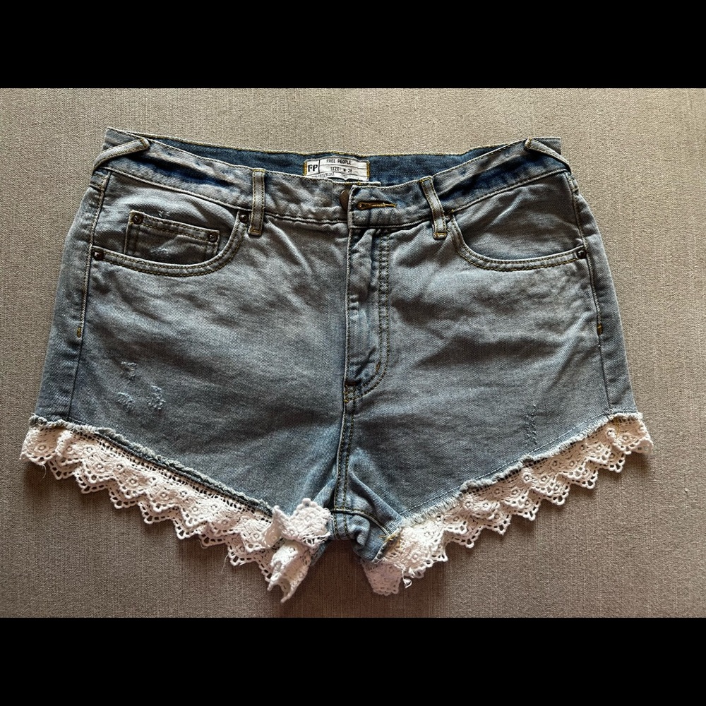 Free People jean shorts with white eyelet detail